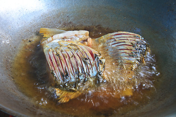 Image showing Fried fish in a frying pan