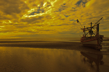 Image showing boat on the beach and sunset 