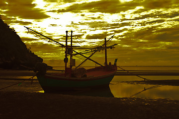 Image showing boat on the beach and sunset 