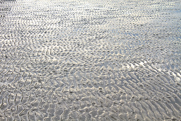 Image showing Beach sand waves warm texture 