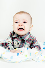 Image showing Adorable baby screaming in a plaid shirt