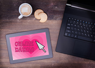 Image showing Online dating on a tablet