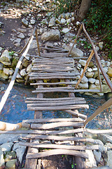 Image showing city ruins Olimpos bridge through a stream