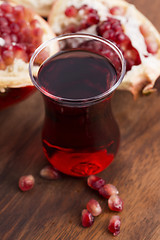 Image showing Ripe pomegranates with juice on table