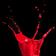 Image showing splash of red paint isolated on black