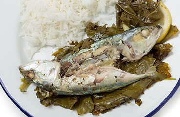 Image showing Fish baked in vine leaves from above