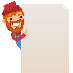 Image showing Lumberjack looking at blank poster