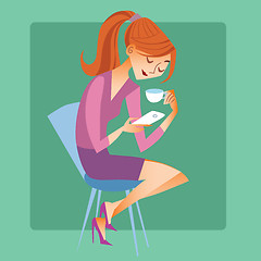 Image showing Young woman sitting with a Cup of coffee or tea and read the mes