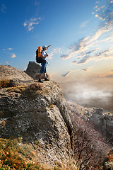 Image showing Tourist on rock