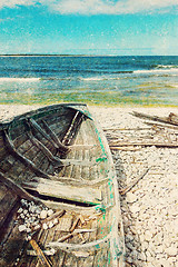 Image showing Old wooden boat on the seashore, retro image