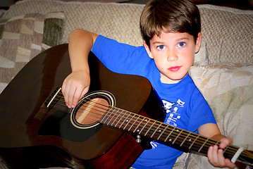 Image showing Boy play guitar