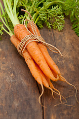 Image showing baby carrots bunch tied with rope