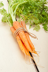 Image showing baby carrots bunch tied with rope