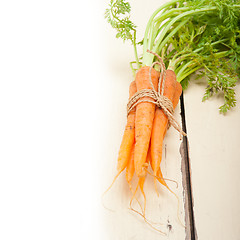 Image showing baby carrots bunch tied with rope