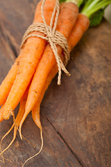 Image showing baby carrots bunch tied with rope