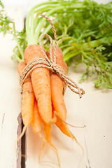 Image showing baby carrots bunch tied with rope