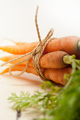 Image showing baby carrots bunch tied with rope