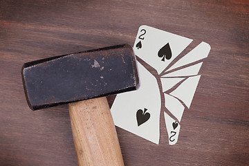 Image showing Hammer with a broken card, two of spades