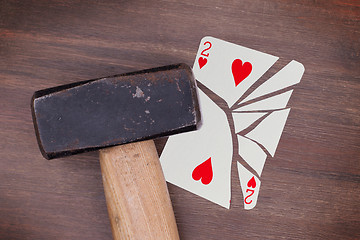 Image showing Hammer with a broken card, two of hearts