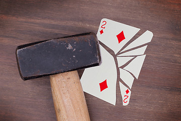 Image showing Hammer with a broken card, two of diamonds