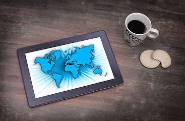 Image showing World map on a tablet
