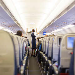 Image showing Stewardess on the airplane.