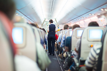 Image showing Stewardess on the airplane.