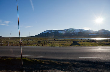 Image showing Sun shining on the road through mountain plateau Valdresflye, Jo