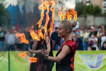 Image showing The girls performed a dance with burning torches