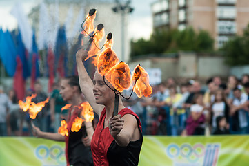 Image showing The girls performed a dance with burning torches