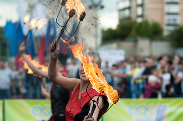 Image showing The girls performed a dance with burning torches