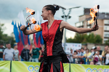 Image showing The girls performed a dance with burning torches