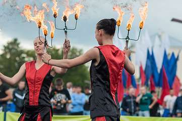 Image showing The girls performed a dance with burning torches