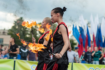 Image showing The girls performed a dance with burning torches