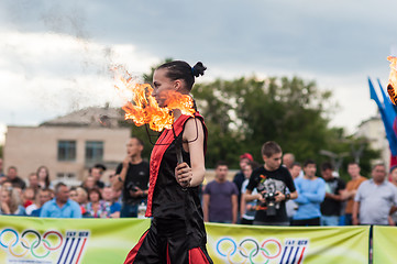 Image showing The girls performed a dance with burning torches