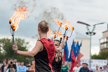 Image showing The girls performed a dance with burning torches