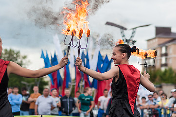 Image showing The girls performed a dance with burning torches