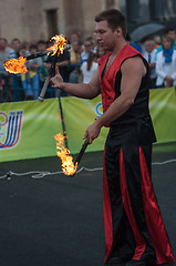 Image showing Juggling flaming batons