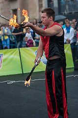 Image showing Juggling flaming batons