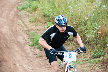 Image showing Competitions cyclists in cross-country 