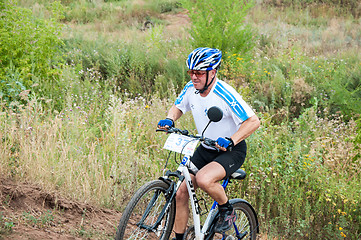 Image showing Competitions cyclists in cross-country 