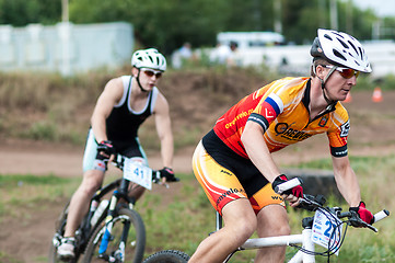 Image showing Competitions cyclists in cross-country 