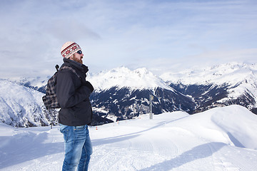 Image showing Young man enjoys the view in the mountains