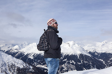 Image showing Young man enjoys the view in the mountains