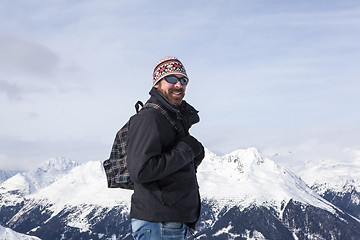 Image showing Young man enjoys the view in the mountains