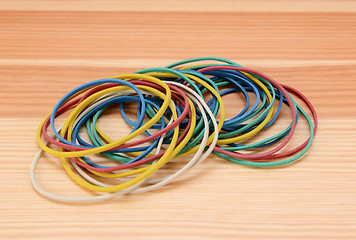 Image showing Large pile of coloured rubber bands