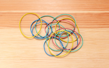 Image showing Handful of coloured elastic bands 