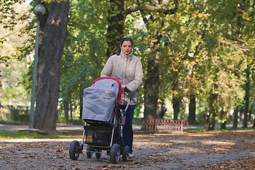 Image showing Mother with pram