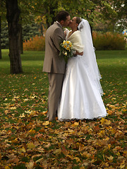 Image showing Young just married kissing in park