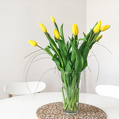 Image showing Bouquet of yellow tulips on a table